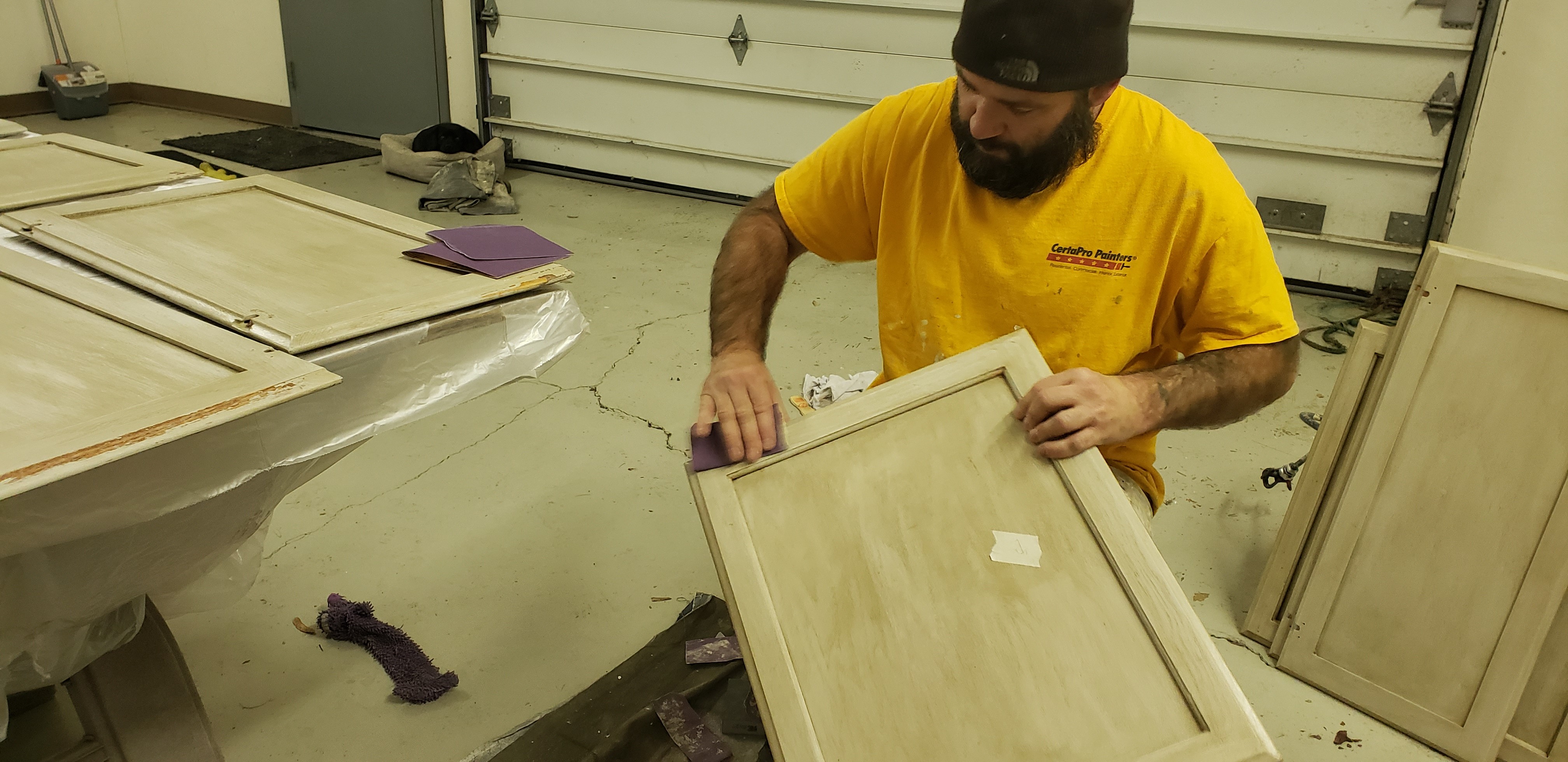 Kitchen Cabinet Painting sanding by CertaPro Painters of Spokane, WA
