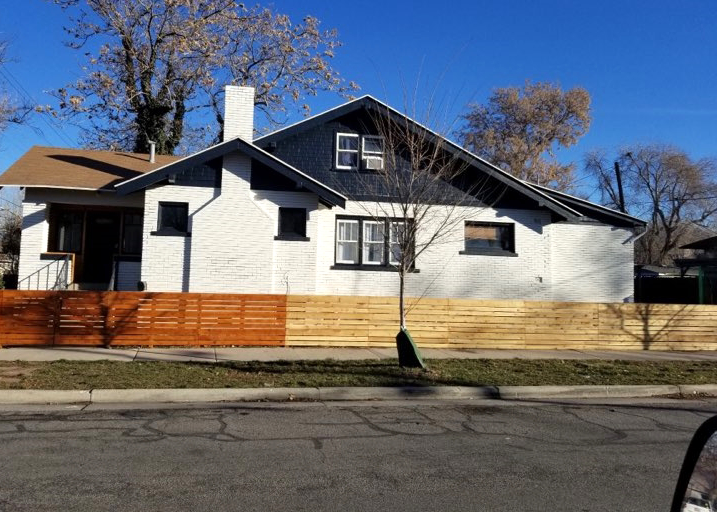 brick and wood home after being painted.