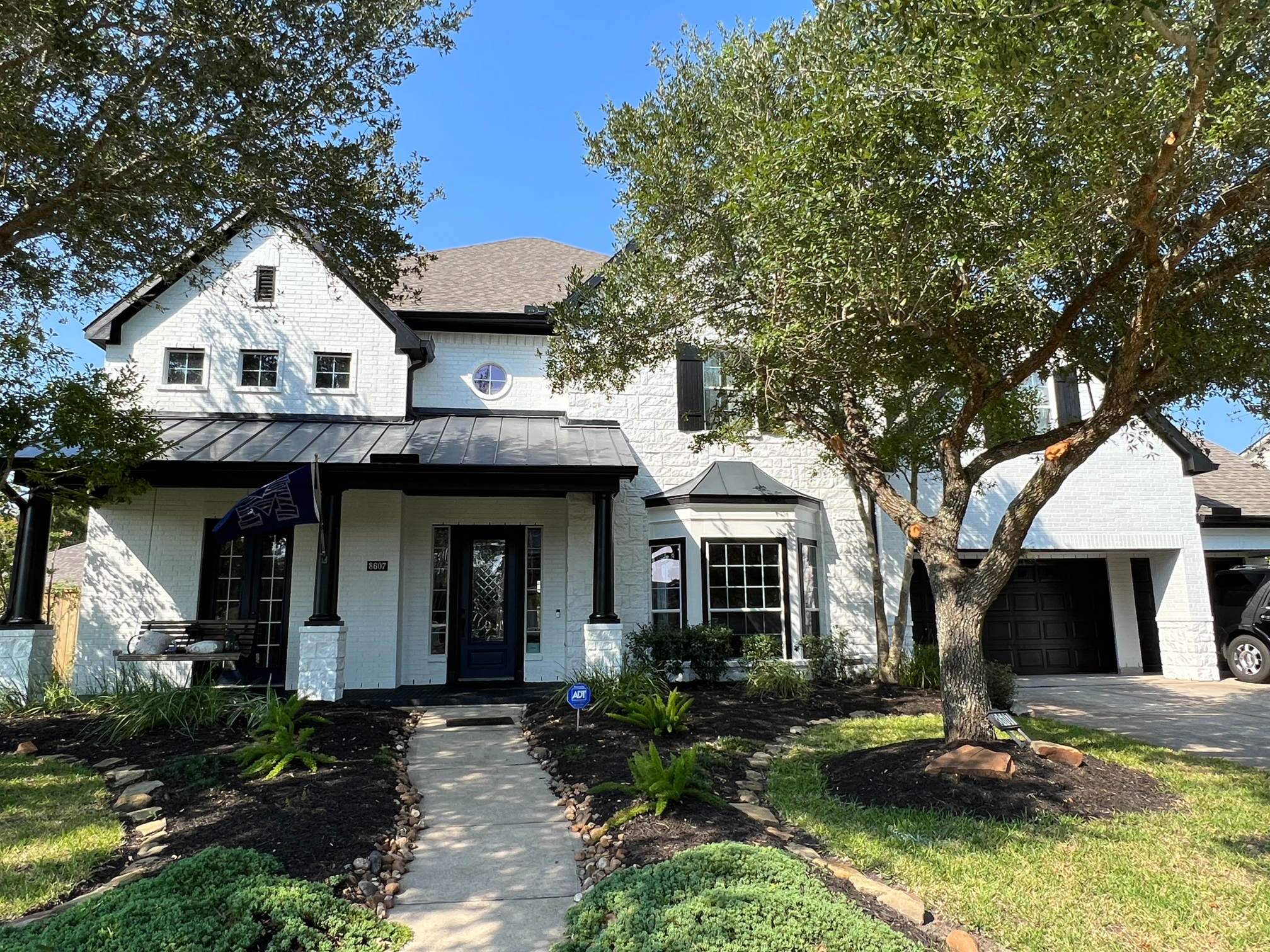 after exterior painting of a brick home in sienna of missouri city, tx