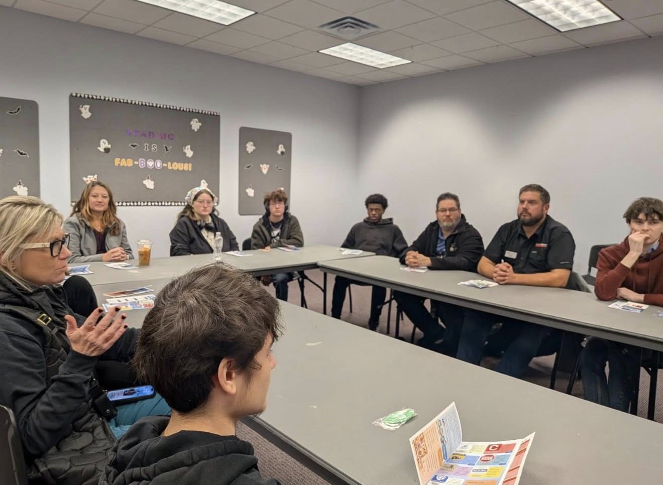 people sitting at board room table