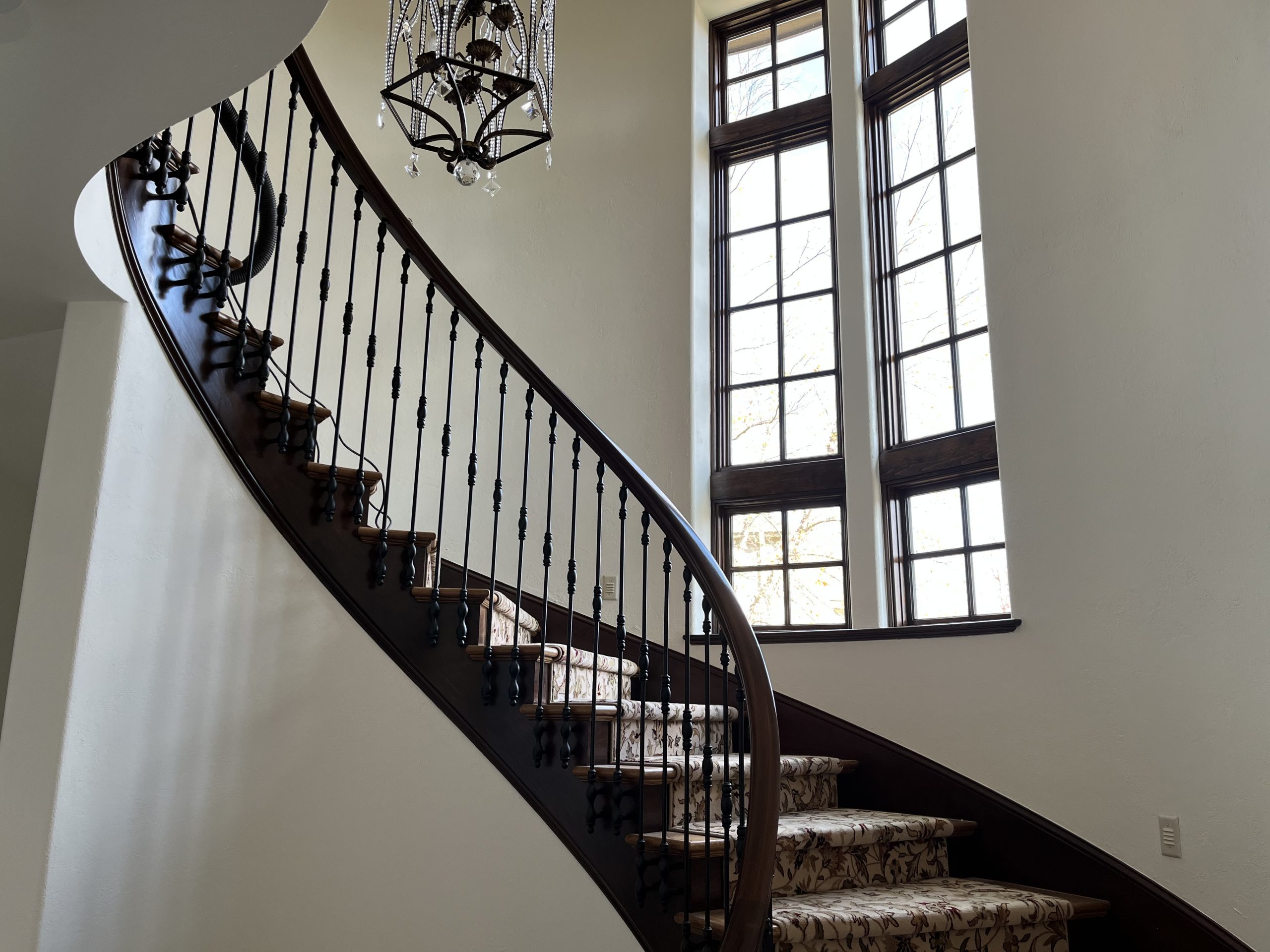 repainted spiral staircase in foyer