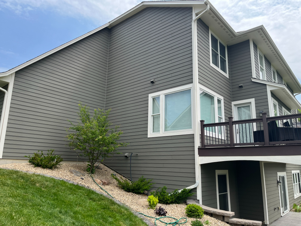 View of repainted house in Plymouth from the side, after painting