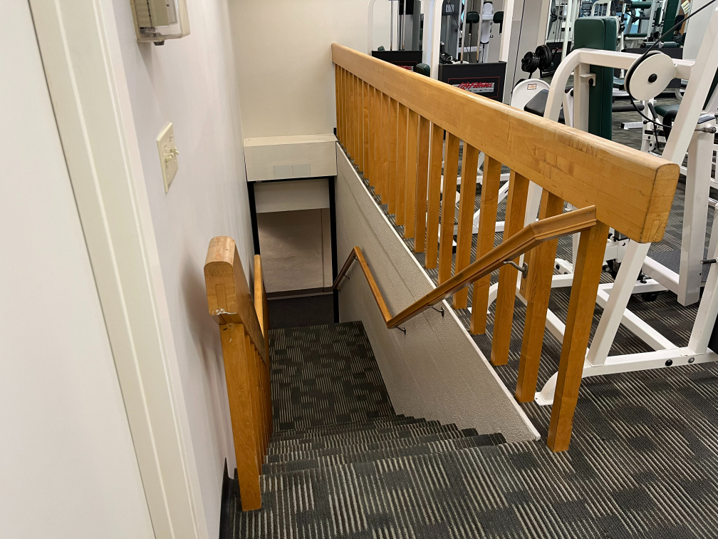 Walls and enamel railings in health club, prior to painting