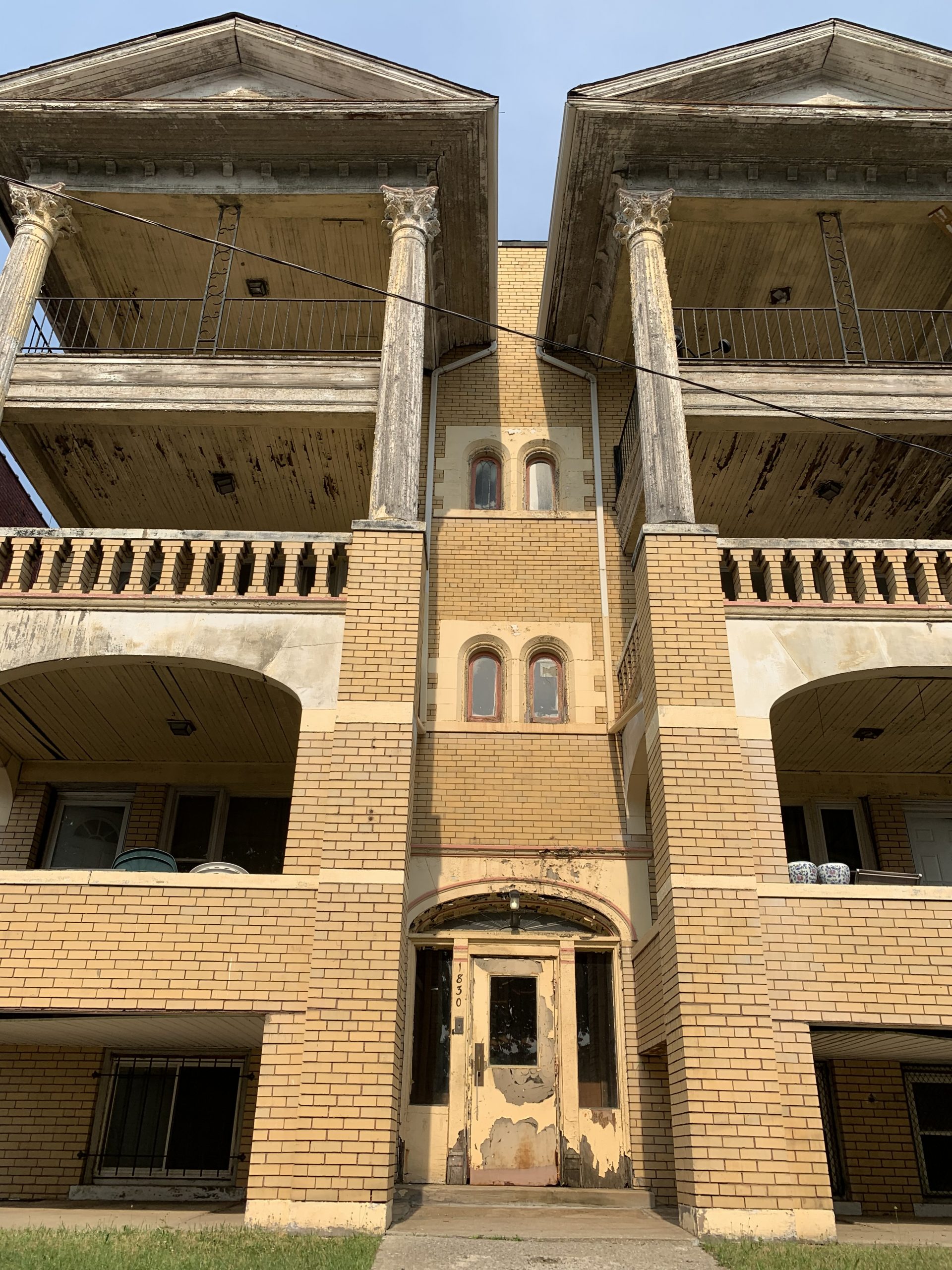 twin tower apartments front view before painting