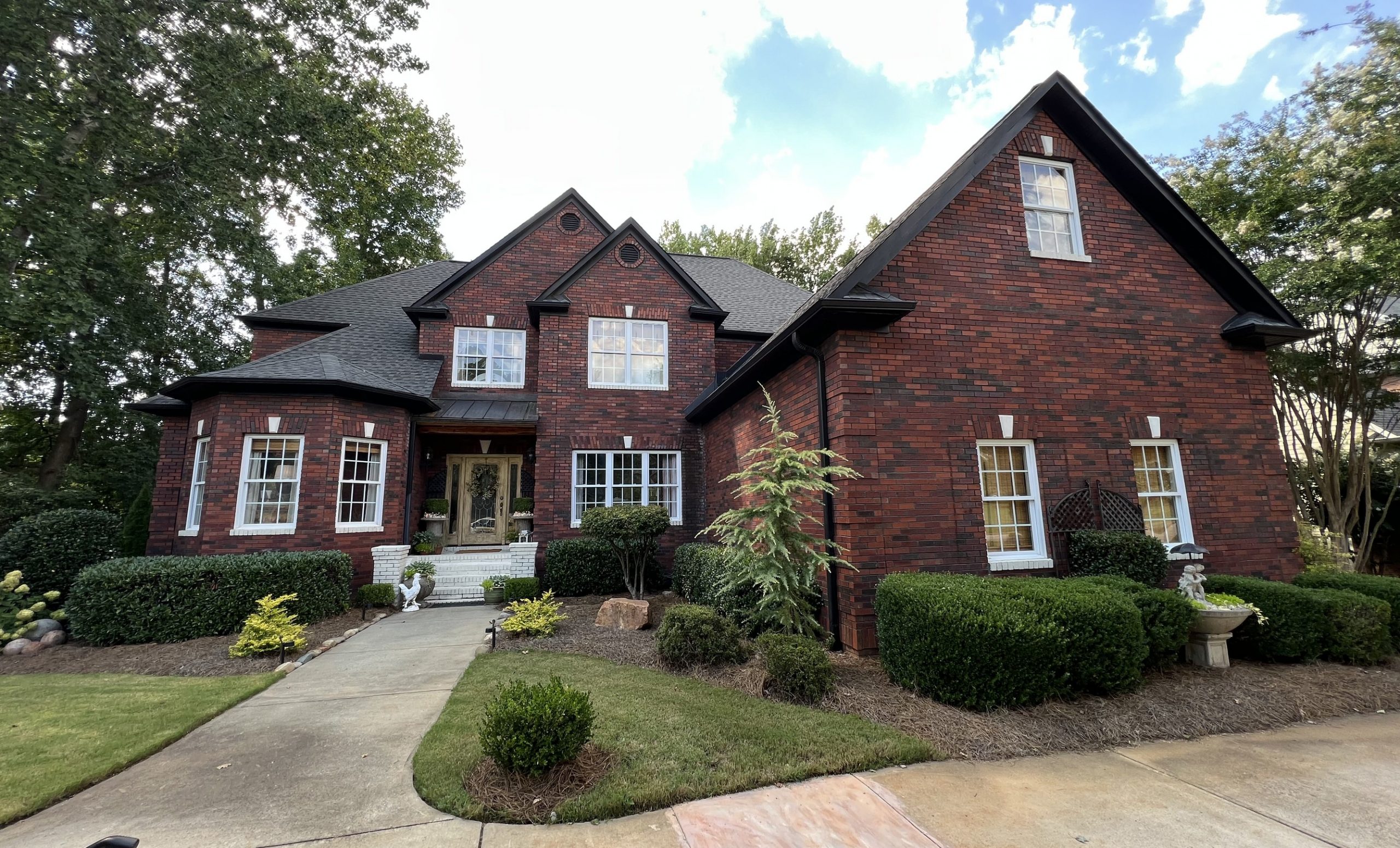 Brick Exterior Painting of Large Home Before
