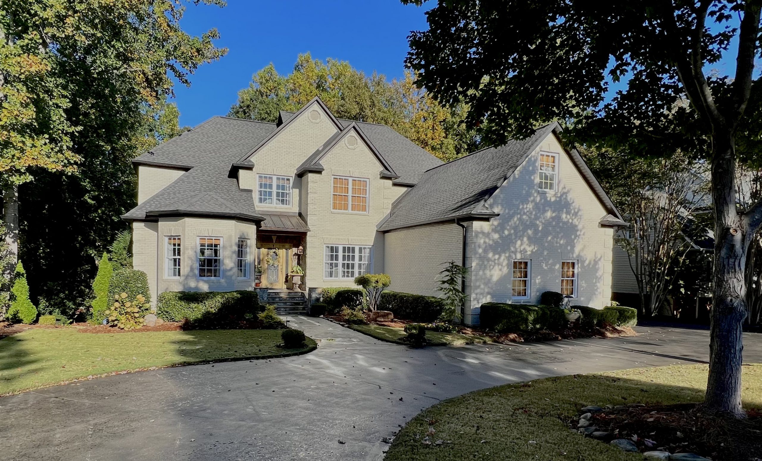 Brick Exterior Painting of Large Home After