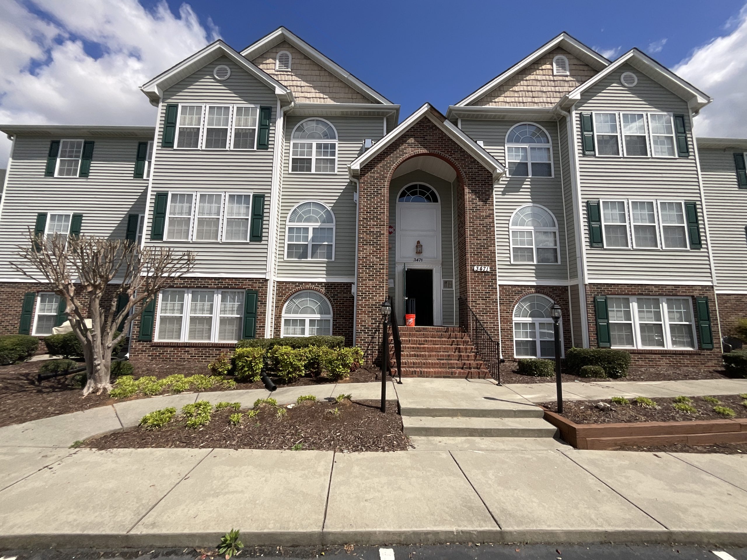 after exterior painting of shudders, entrance, and railings