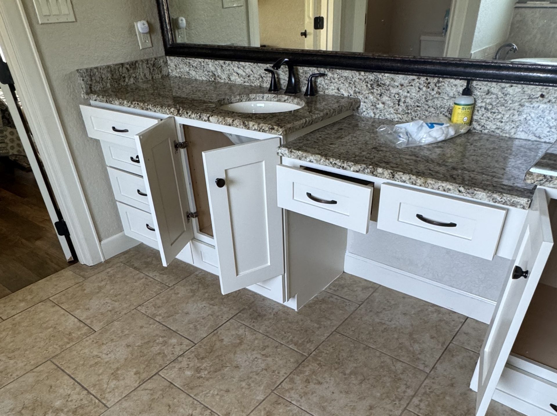 bathroom vanity and white cabinets
