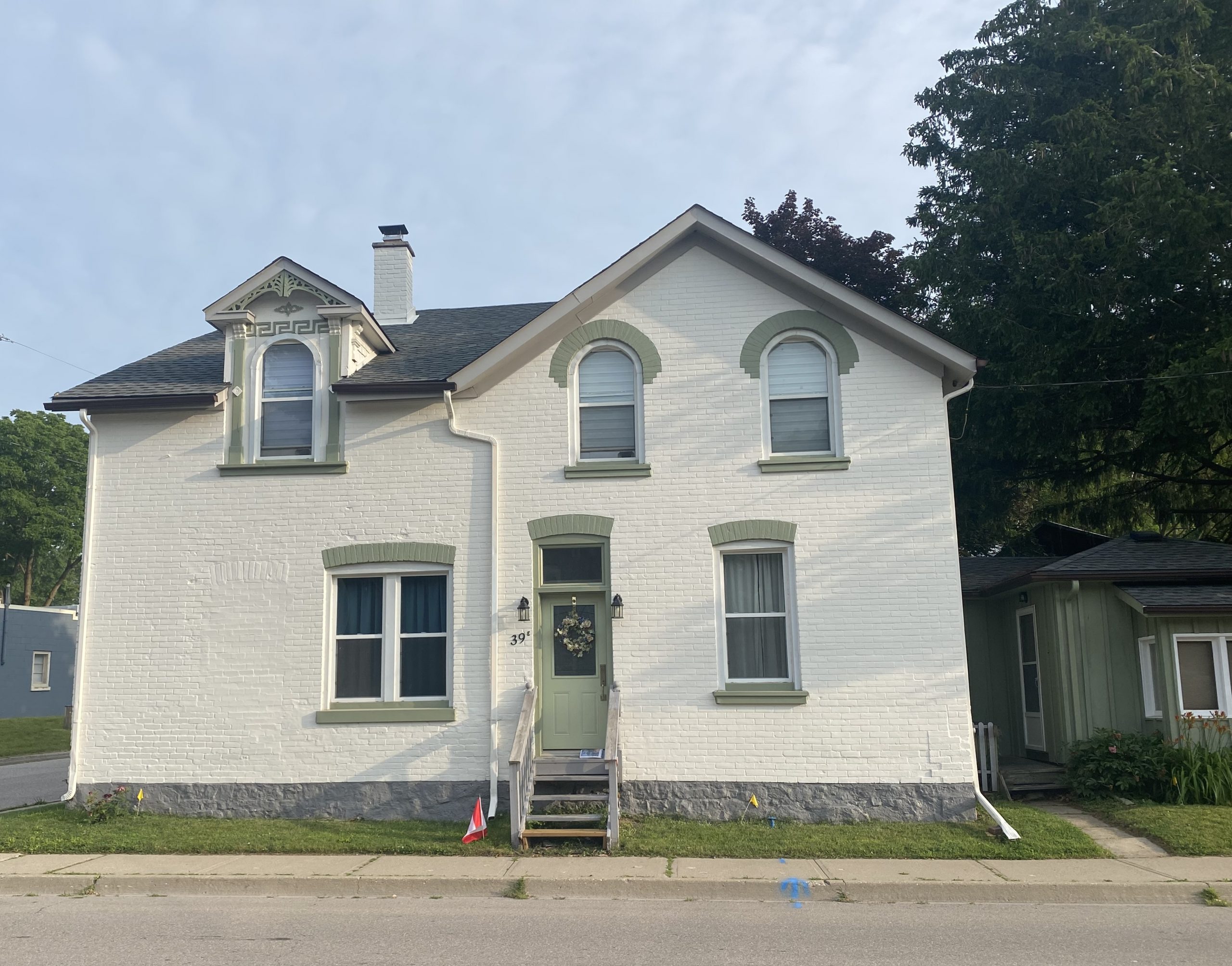 White Brick Exterior w/ Green Trim