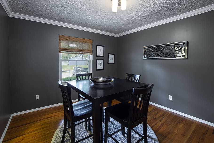 dining room with dark grey walls