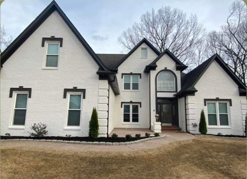 Brick home after being painted.