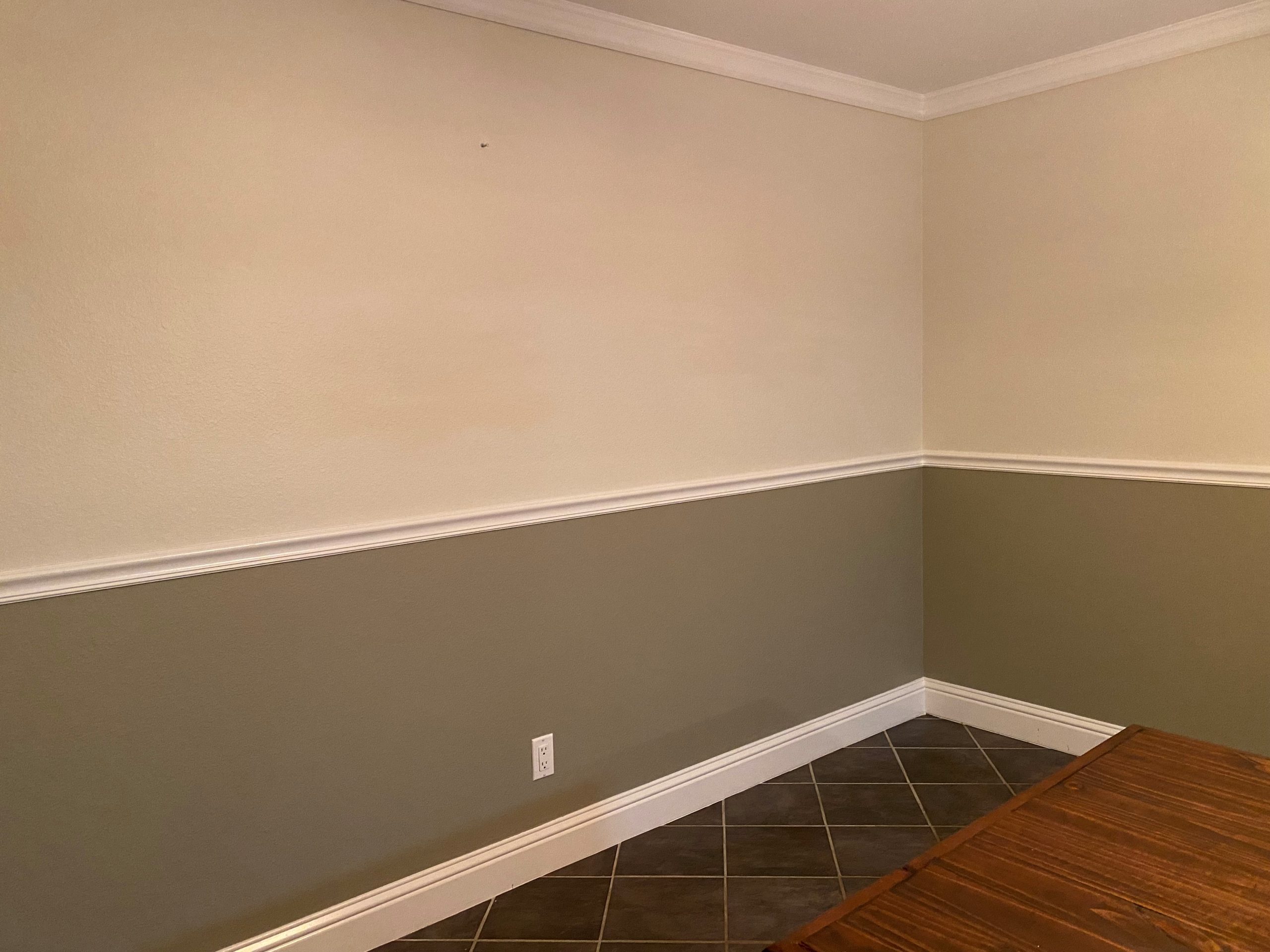 A complementary paint color is added below the chair rail.