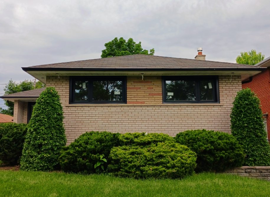 Before we painted this home's brick exterior in Princess-Rosethorn
