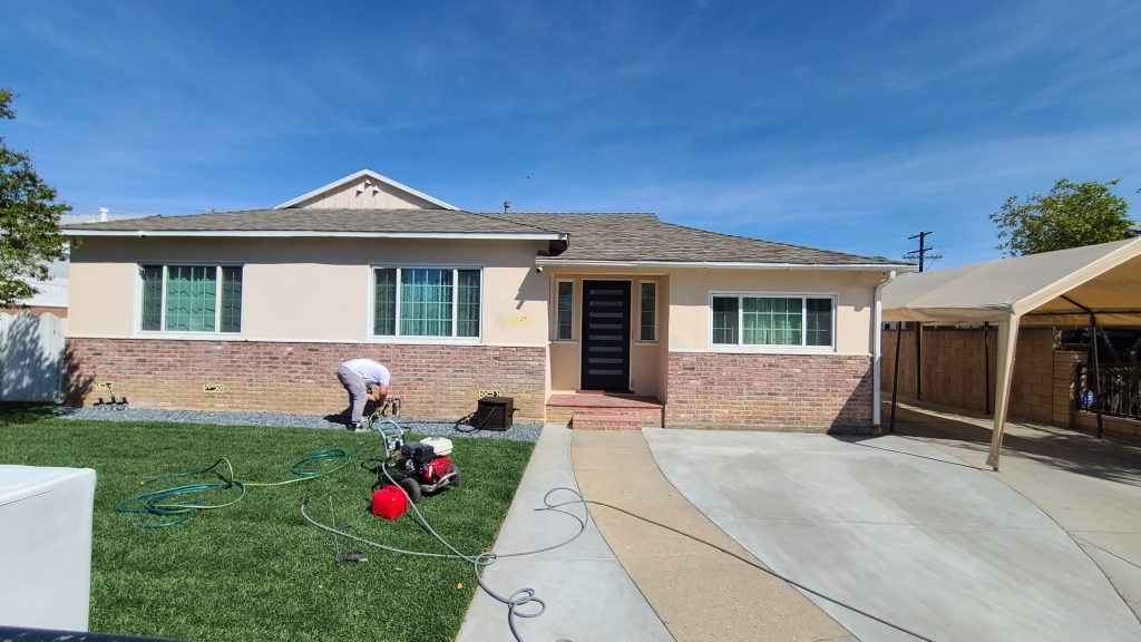 A ranch home in Encino before being repainted all white, including painting the brick.