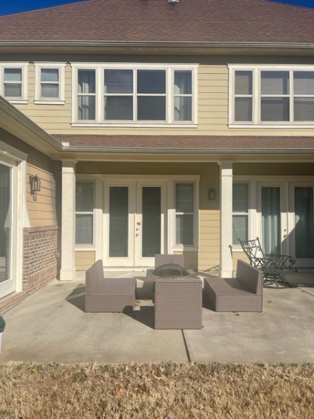 Back of tan house in Fairburn, GA before residential exterior painting project by CertaPro Painters of Peachtree City/Coweta County, GA