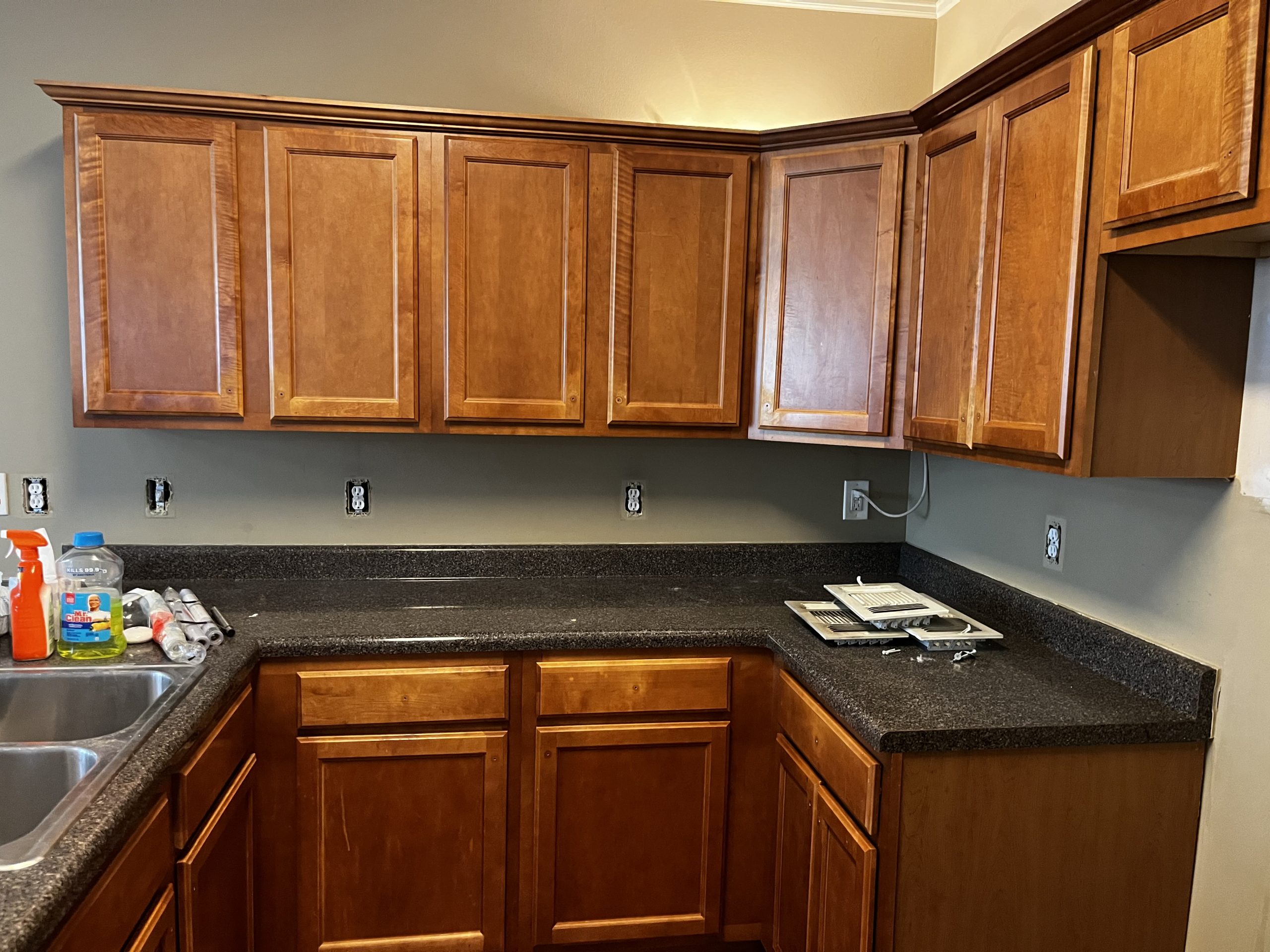 Kitchen in Tyrone, GA, before residential interior and kitchen cabinet painting project by CertaPro Painters of Peachtree City/Coweta County, GA - Angle 2