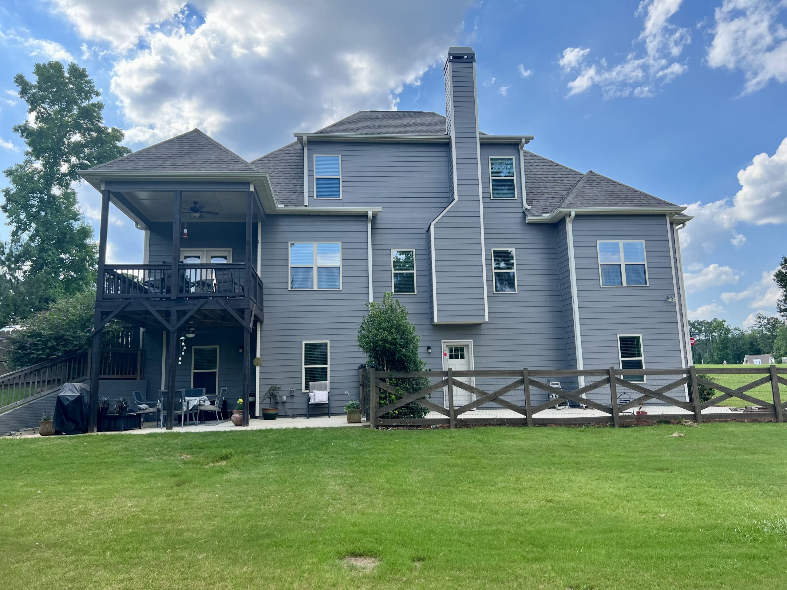 Side of gray home in Senoia after painting project