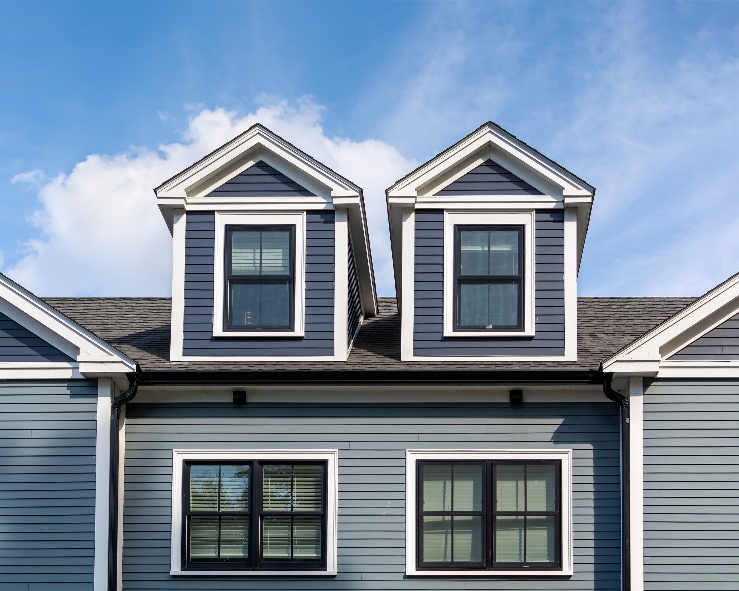 Detailed exterior trim work on a two-tone home