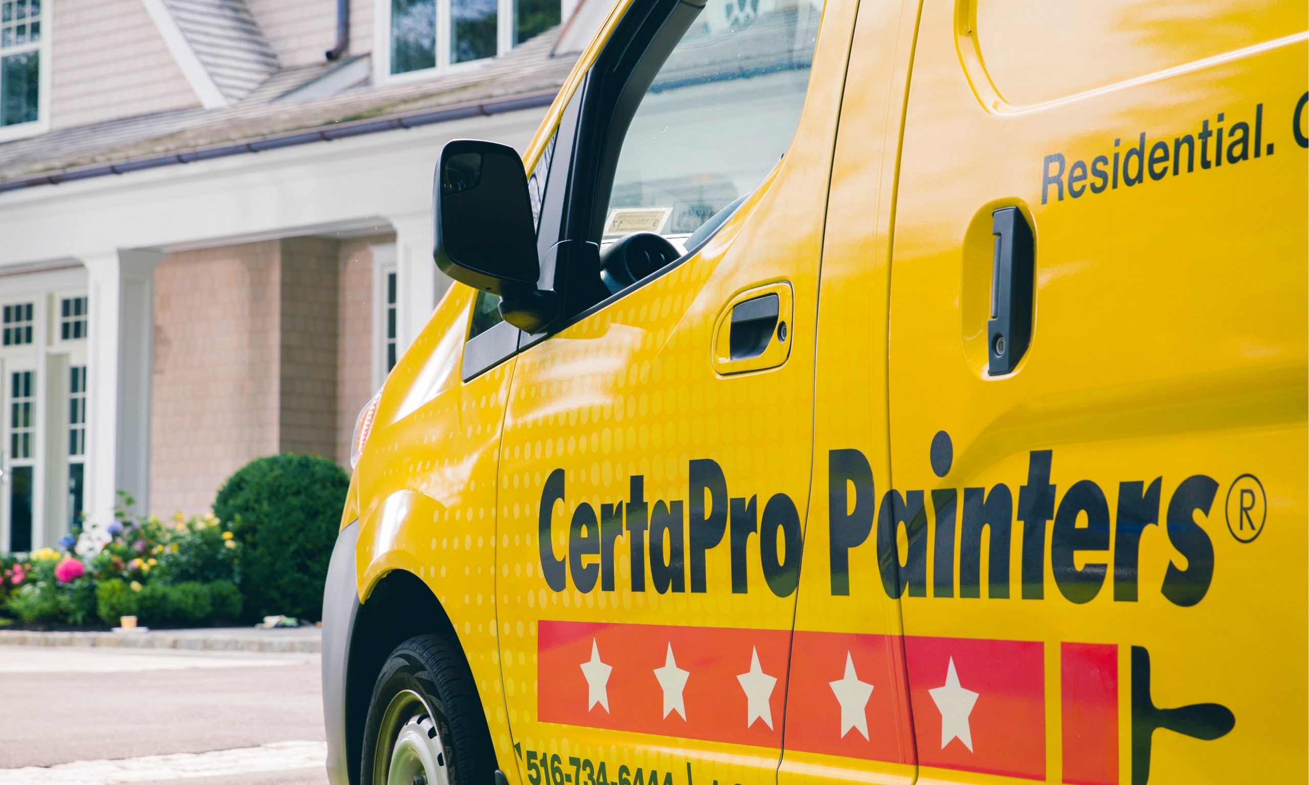 Professional crew painting exterior trim