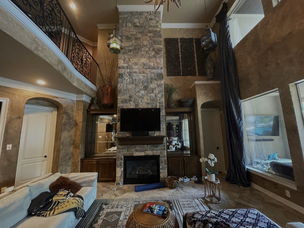 living room with wallpaper before removal and painting