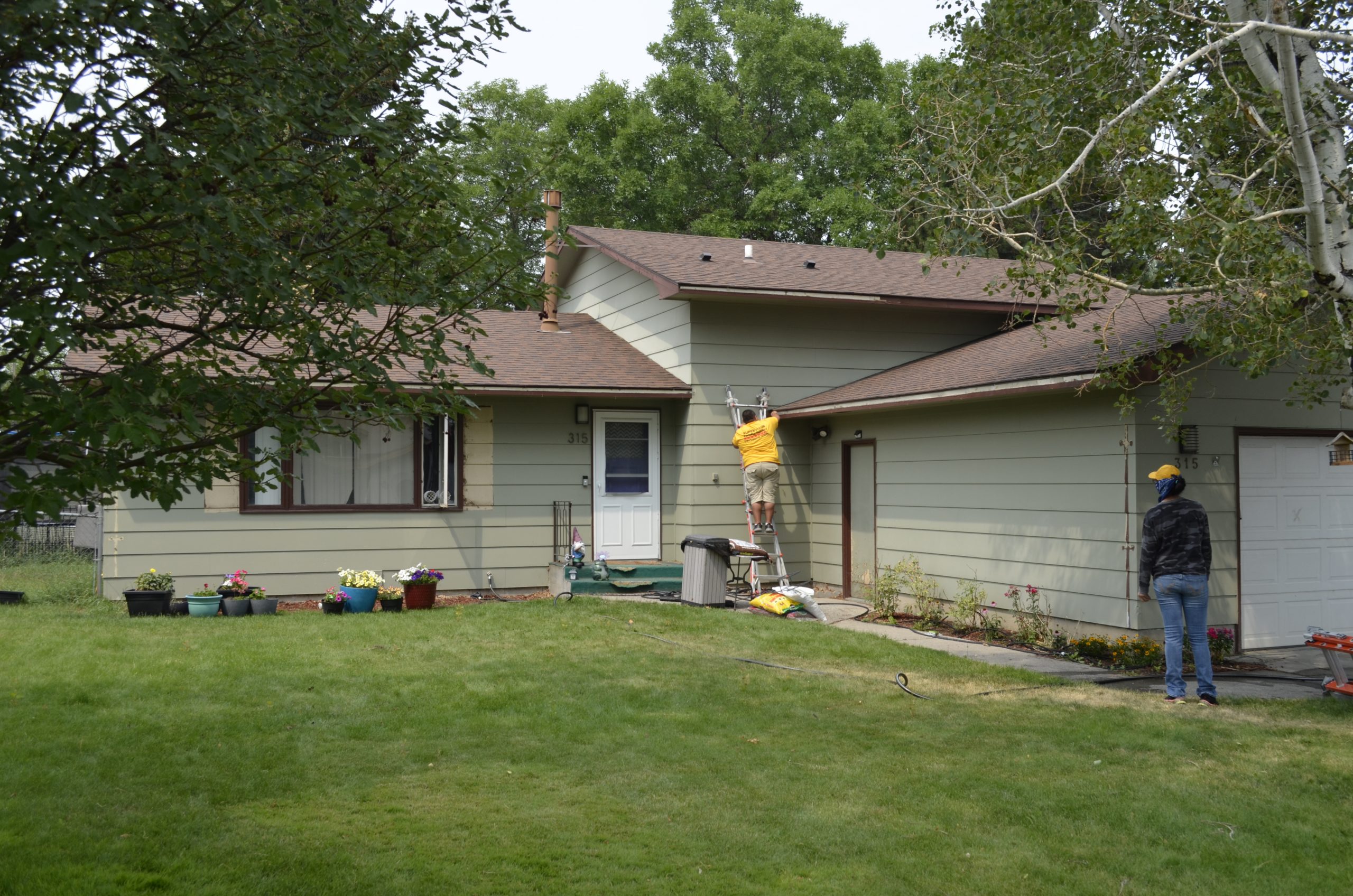 Before photo of beige colored house