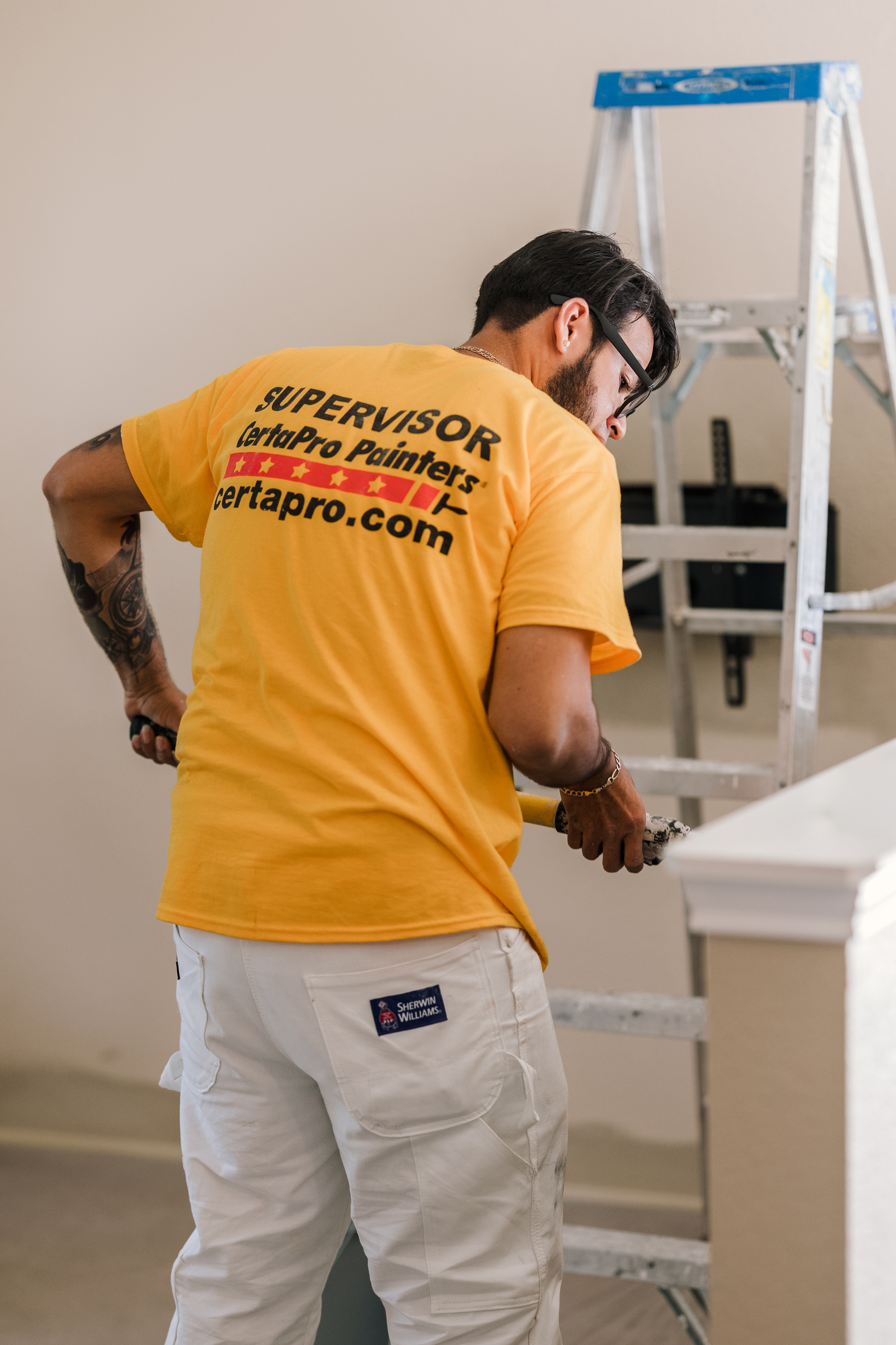 painter painting after prepping