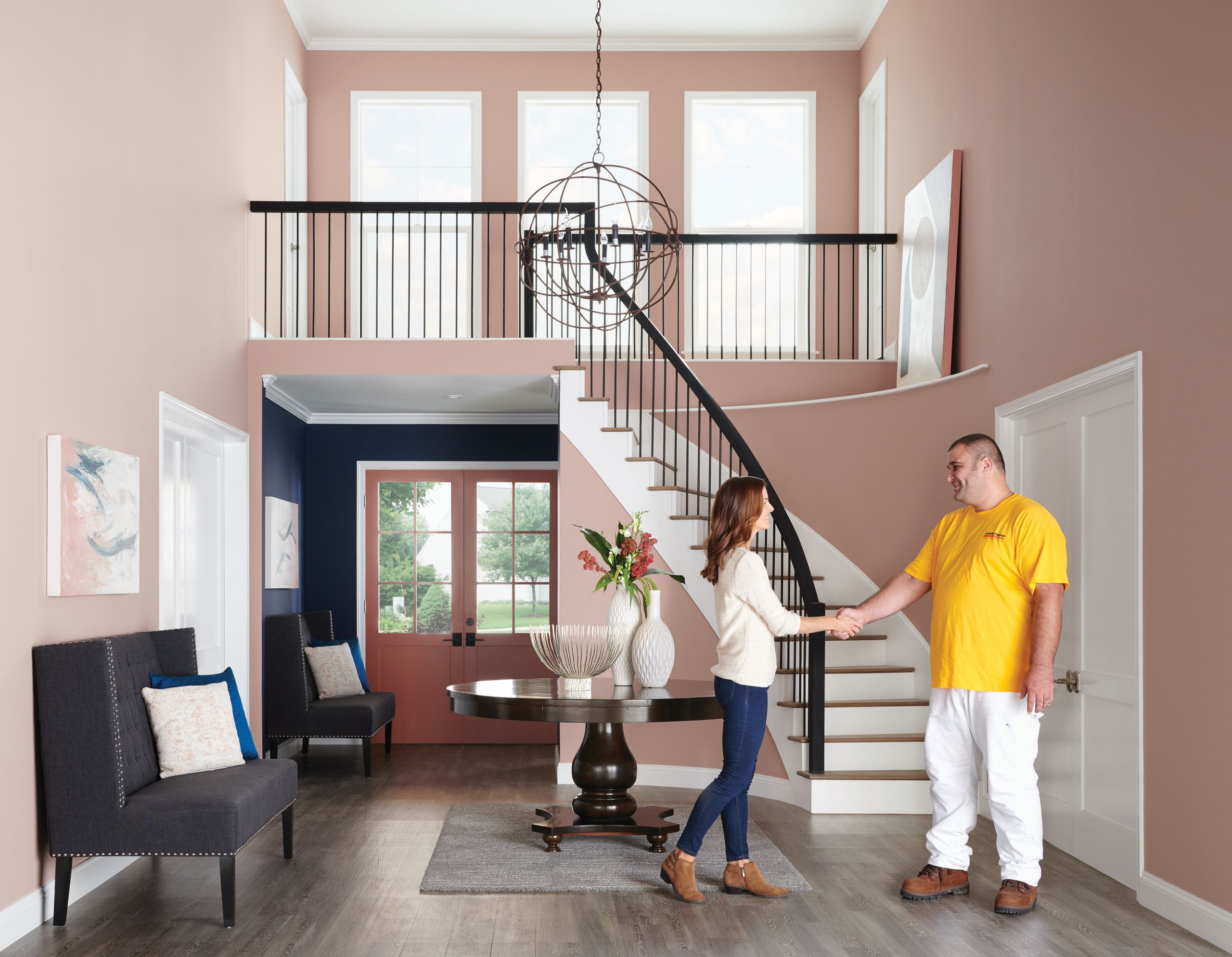 homeowner receiving painting estimate in foyer