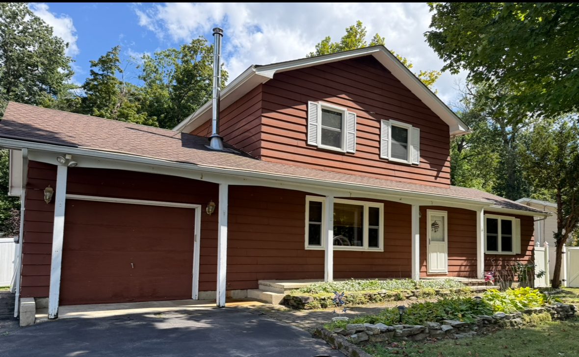 red and brown siding on front of house