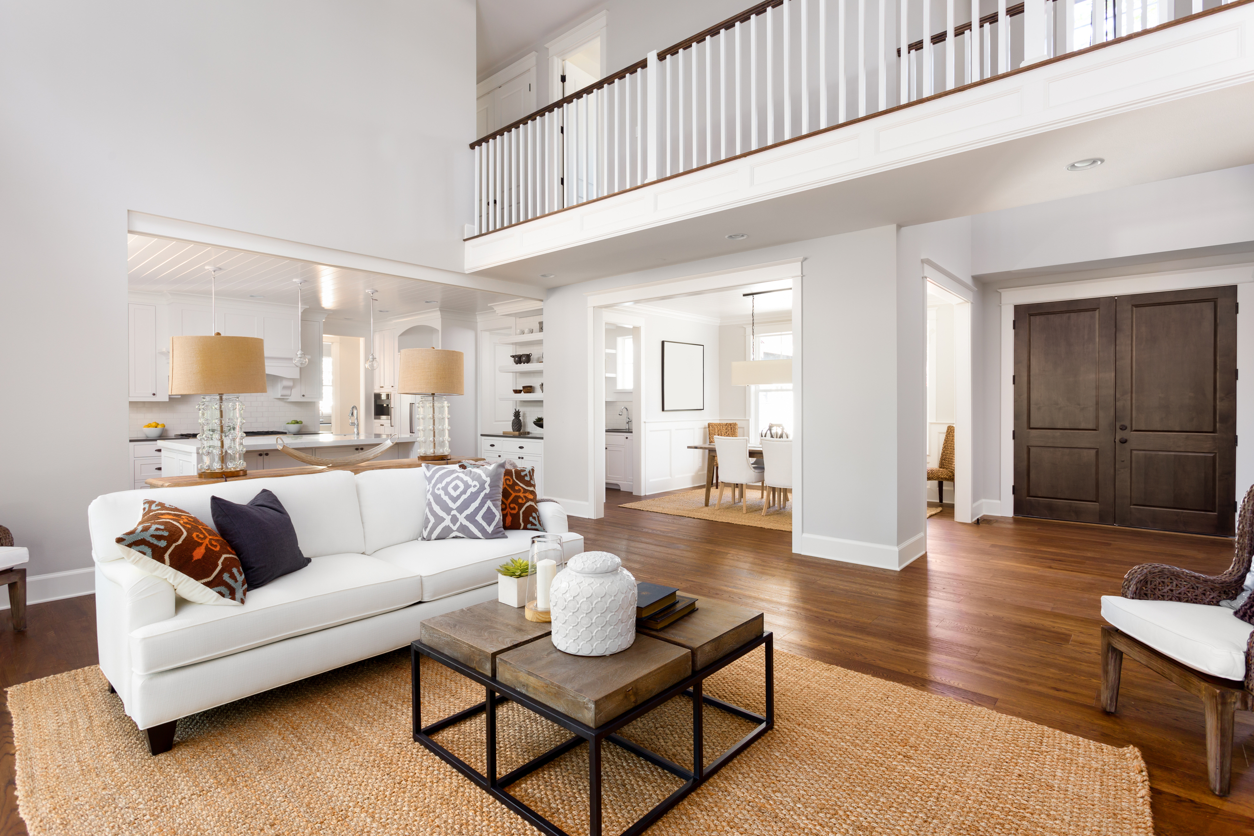 gray neutral living room with dark brown door
