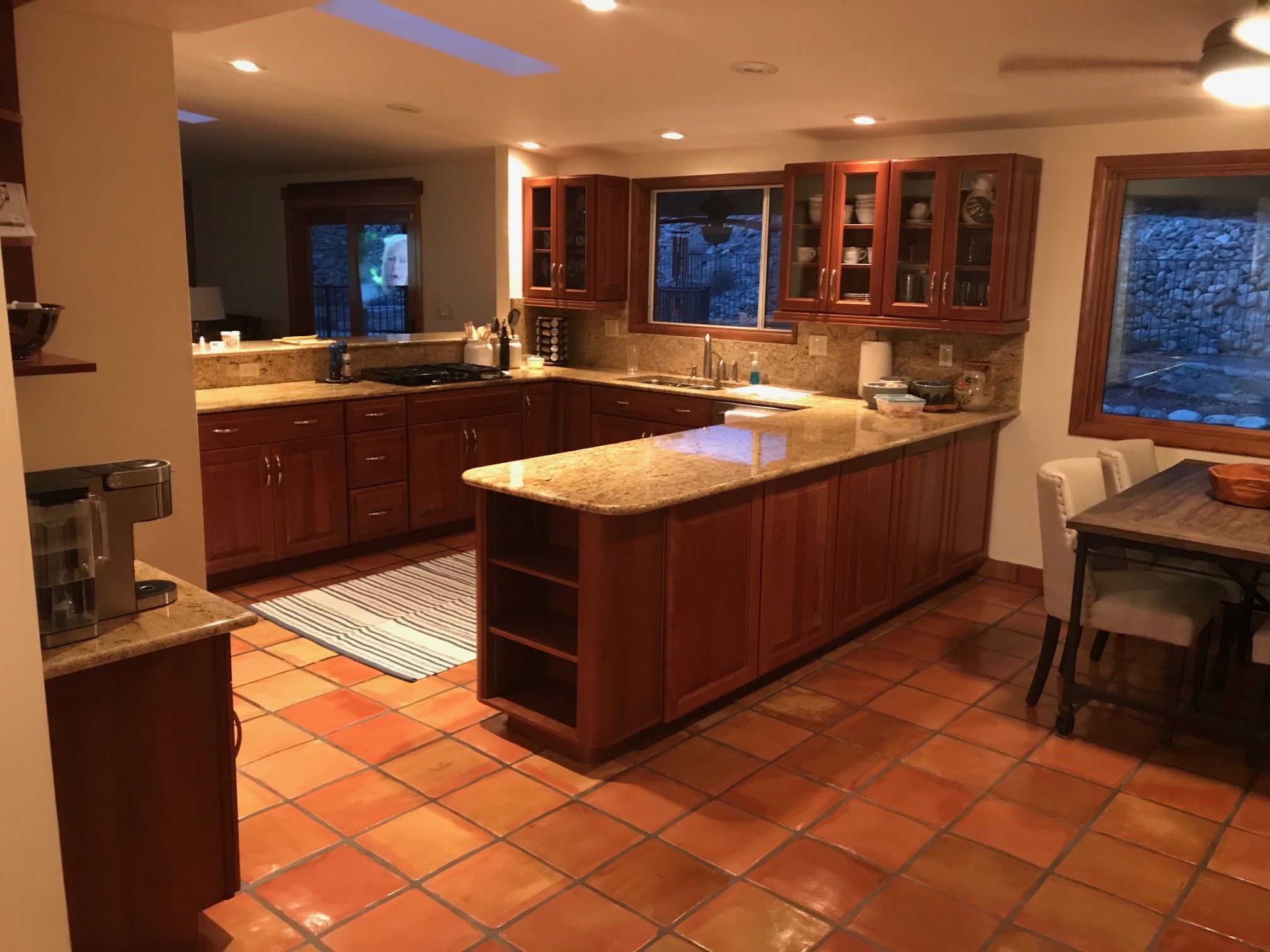 brown kitchen cabinets with granite countertops