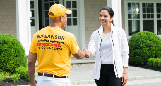 certapro painter team member shaking hands with client