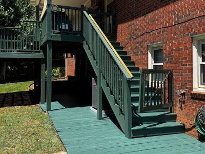 outdoor wooden porch and staircase painted green