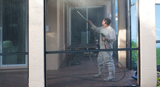 Commercial Power Washing Services washing the side of a condo