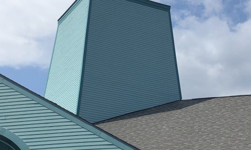 Our commercial team repainted this tower on the Village Center building on Priestman St.