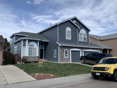 Blue homes with white trim is rising in popularity in Colorado.