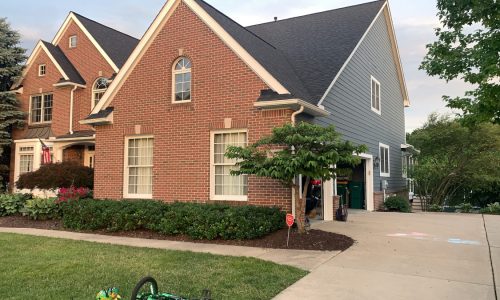 An Interesting Mix of Brick, Siding and Trim.