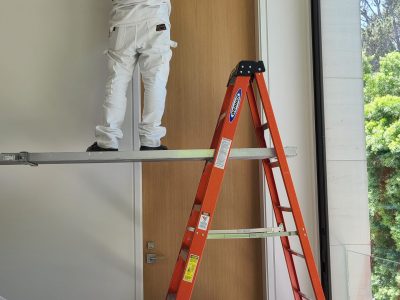 Painting 12 foot ceilings in a Bel Air Mansion .