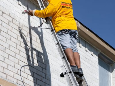 brick painting certapro on ladder