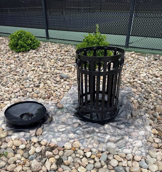 black painted trash receptacle