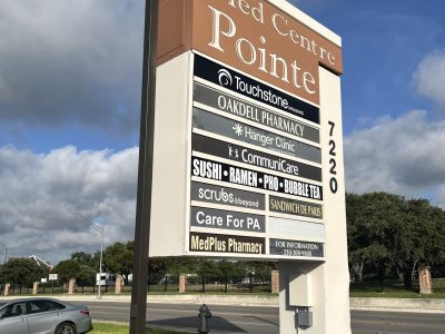 repainted retail pylon sign and light poles