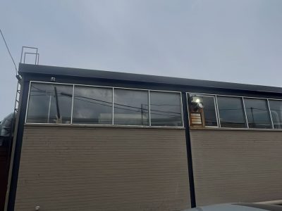 back view of exterior brick painting for commercial building