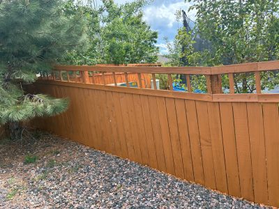 stained wooden privacy fence surrounding residential property
