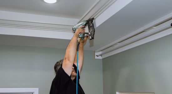 Man installing crown molding