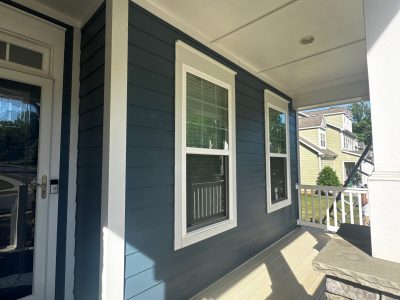 house exterior with blue painted siding and white trim