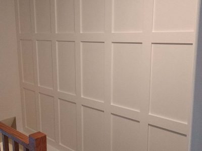 painted wall with wood paneling in grid pattern