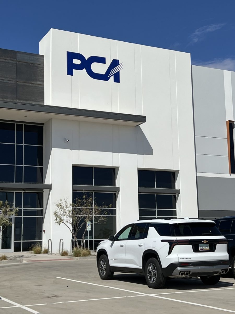 white and commercial building with blue painted logo Preview Image 1