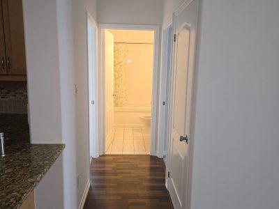 condo interior painting hallway to bathroom