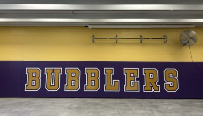 school logo painted on wall