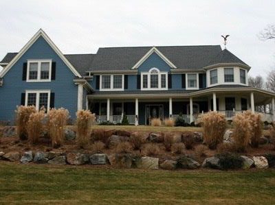 Blue Large house with black shutters