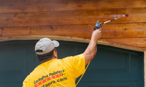 Exterior wood siding being painted